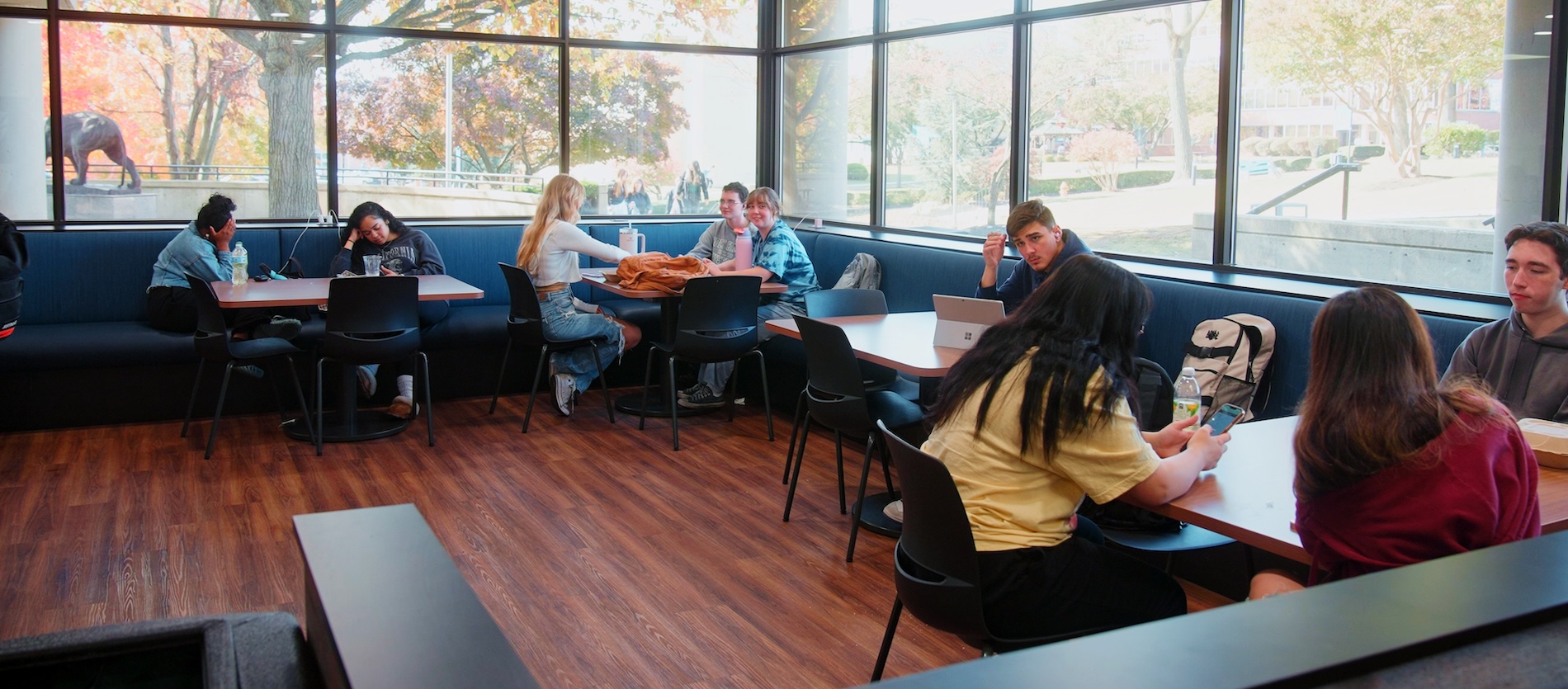 Students at tables sitting in the Campus Center cafeteria