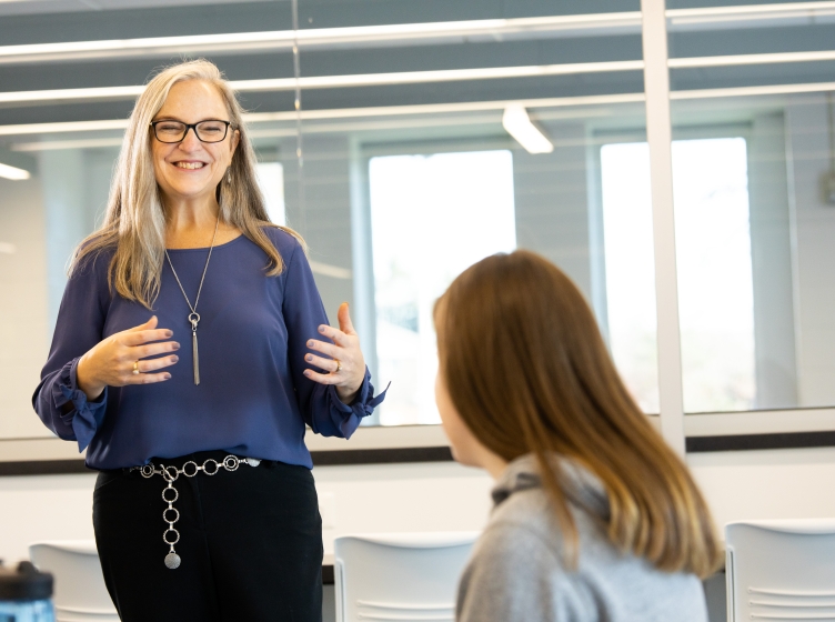 Dr. Kristin Saggedy speaks to a student