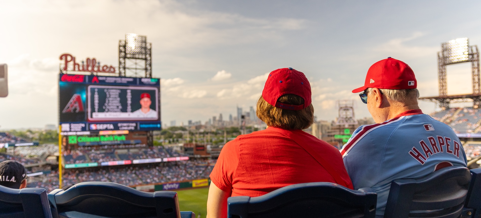Two alum enjoying the Phillies game during a beautiful sunset