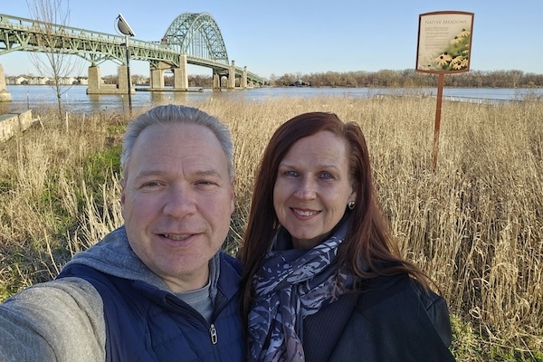 Ron and Dana Russikoff (’92) stand in front of the site of their proposed venture