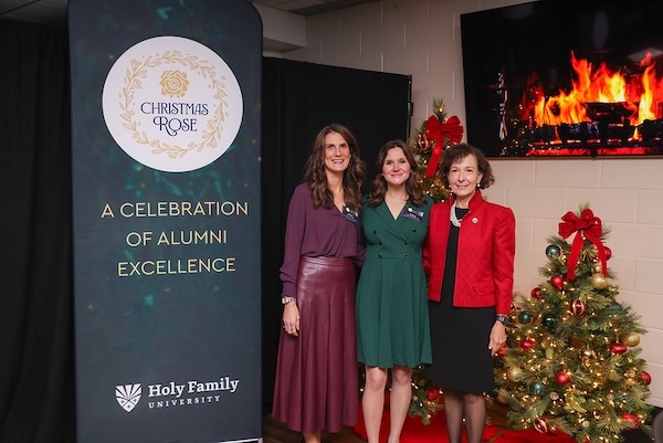 University President Dr. Prisco with alum award recipients at Christmas Rose celebration