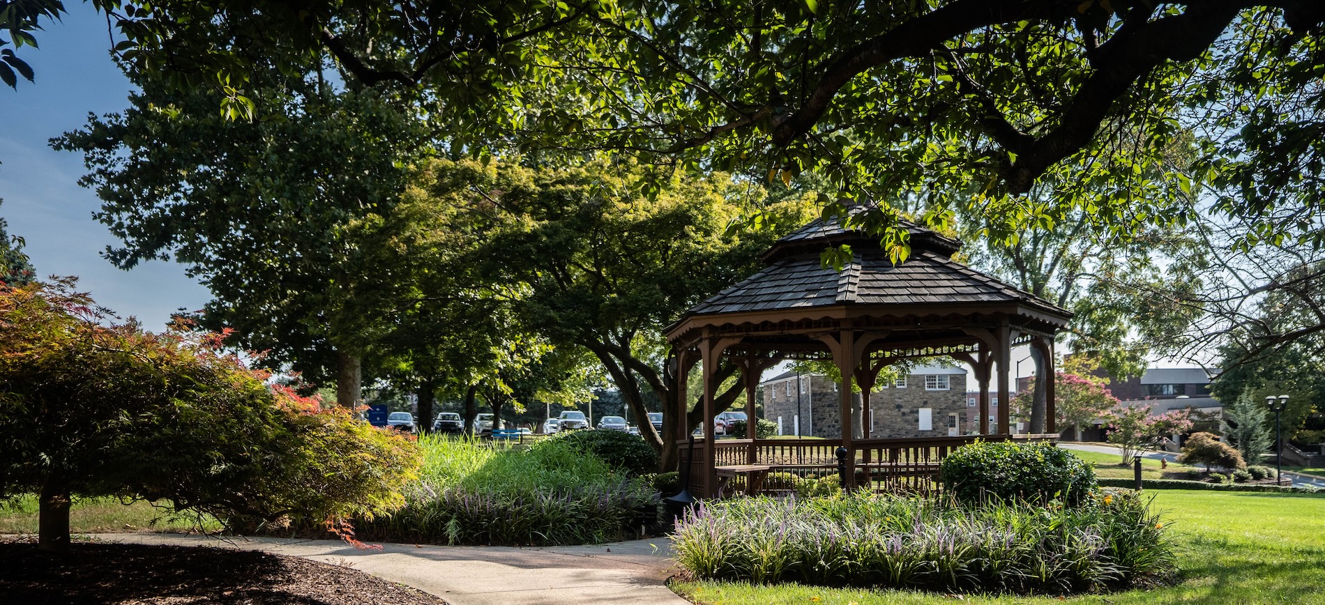 HFU campus path with gazebo on right and shrubs and trees on left