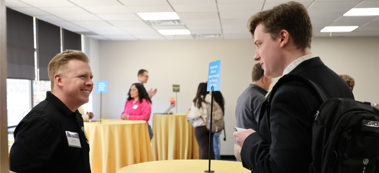 Two people speaking at a Professional Week event